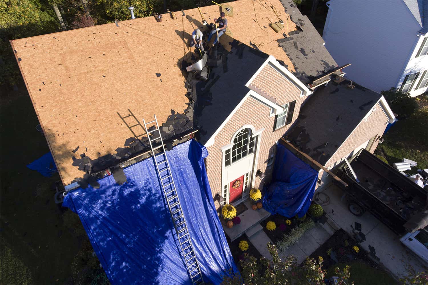 an aerial view of a roof being installed on a house.