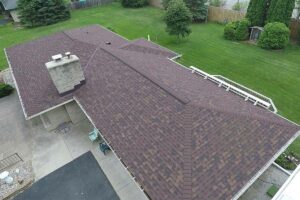 an aerial view of a brown shingled roof.