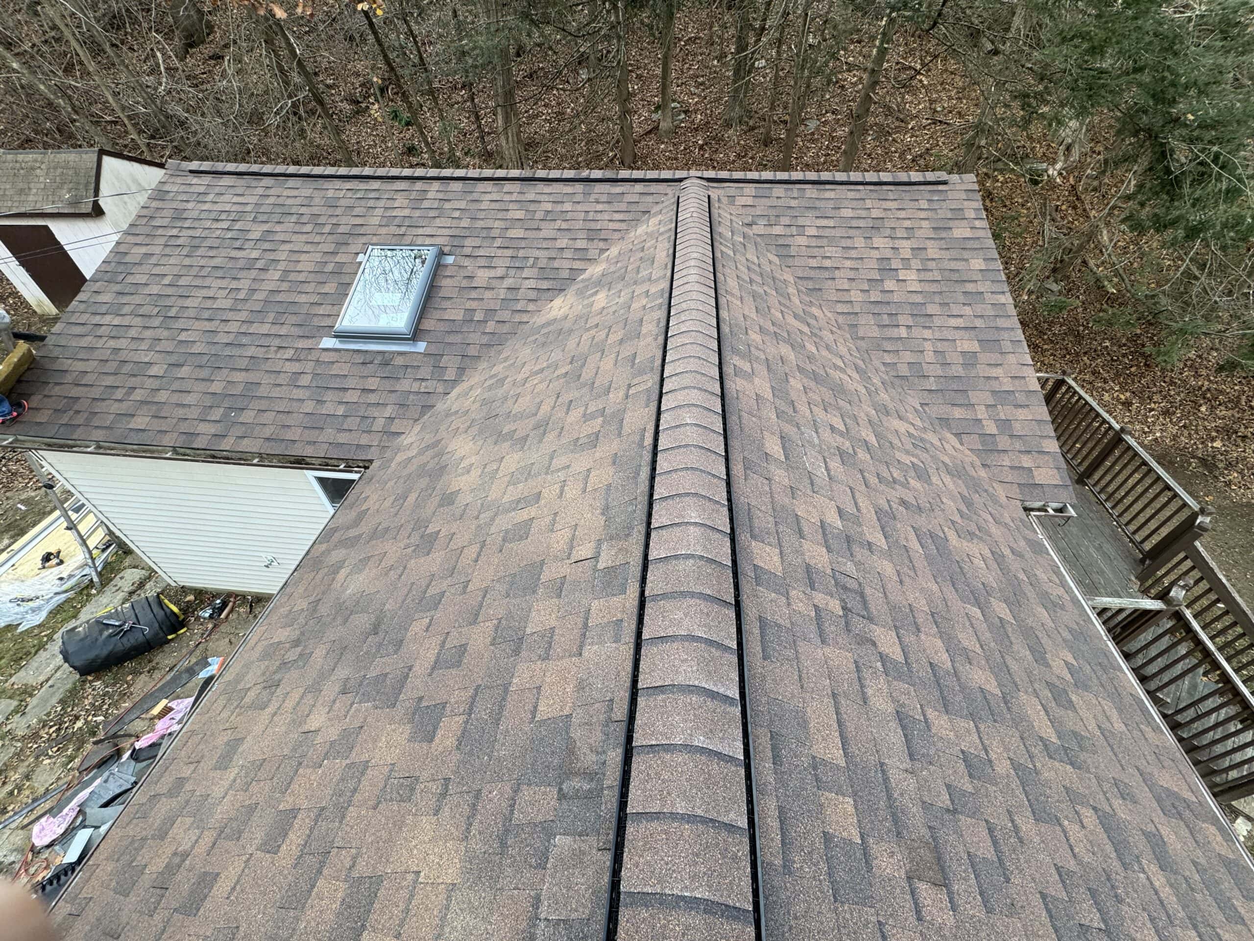 an aerial view of a roof with a shingled roof.